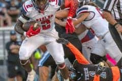 Springstead,2, Tyree Davis escapes the tackle by Nature Coast Tech, 1, Aveion Jackson Friday night 9/8/23 in Brooksville. Photo by Joe DiCristofalo