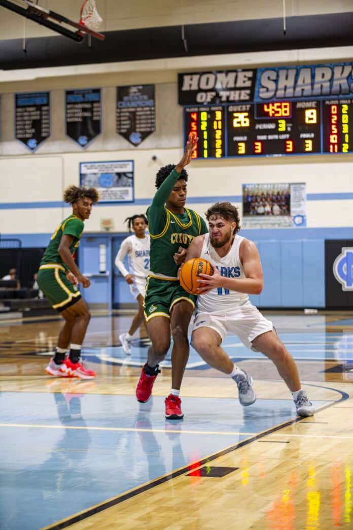 NCT's Jeremy Gonzalez driving the ball up the court.