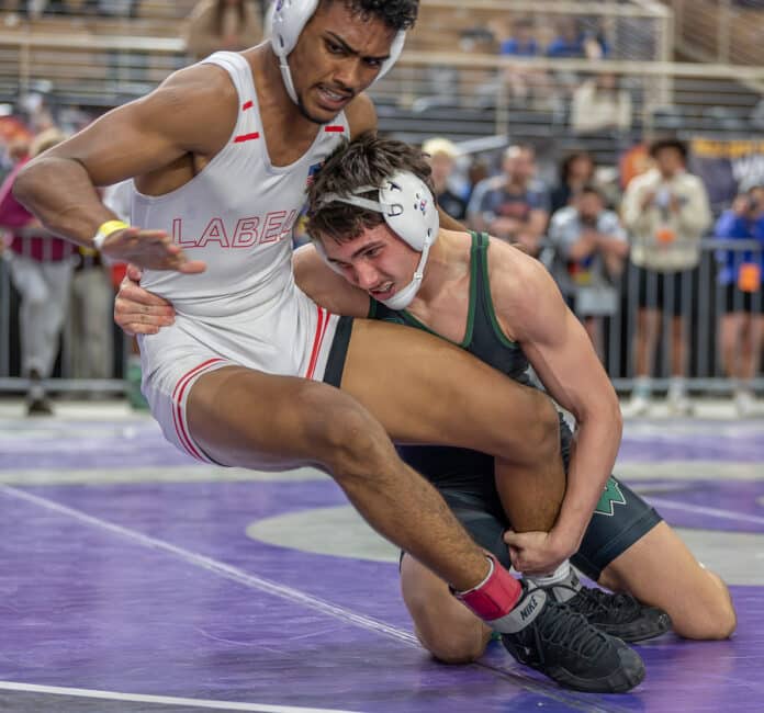 Weeki Wachee 144 pound Ricky Bowamaster needs overtime to get by Devon Jackson from LaBelle 5-3 at the FHSAA wrestling 2024 championships in Kissimmee. [Photo by Joe DiCristofalo]