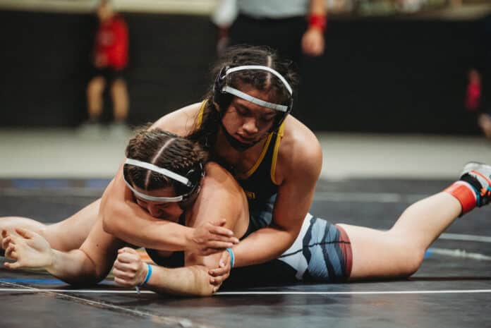 Grace Leota with the crossface against Megan Preston in the championship finals match at Silver Spurs Arena. [Credit: Cynthia Leota]