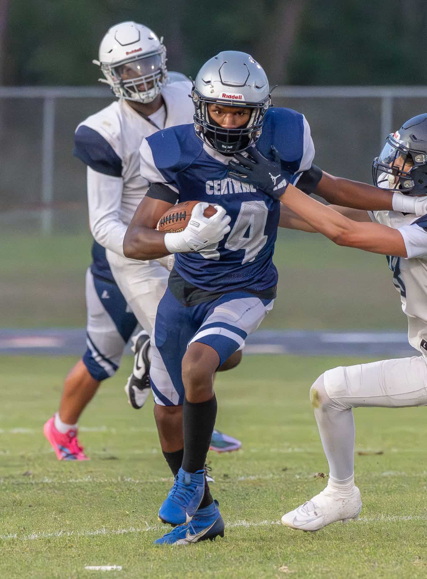 Central High’s,14, Chris Hill uses a stiff arm to gain extra yardage in the game with visiting Wesley Chapel Friday at the Bear Den. Photo by [Joseph DiCristofalo]