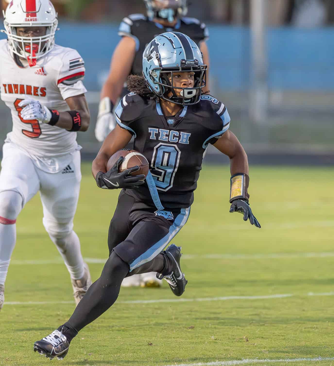 Nature Coast Tech, 9, Jasir Harvin finds running room in the game with visiting Tavares High School Friday in Brooksville. Photo by [Joseph DiCristofalo]