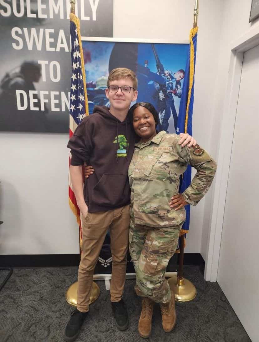 Hunter Gloetzner (left) with his recruiting officer, Air Force Sergeant Bailey (right). [Photo credit: David Gloetzner]