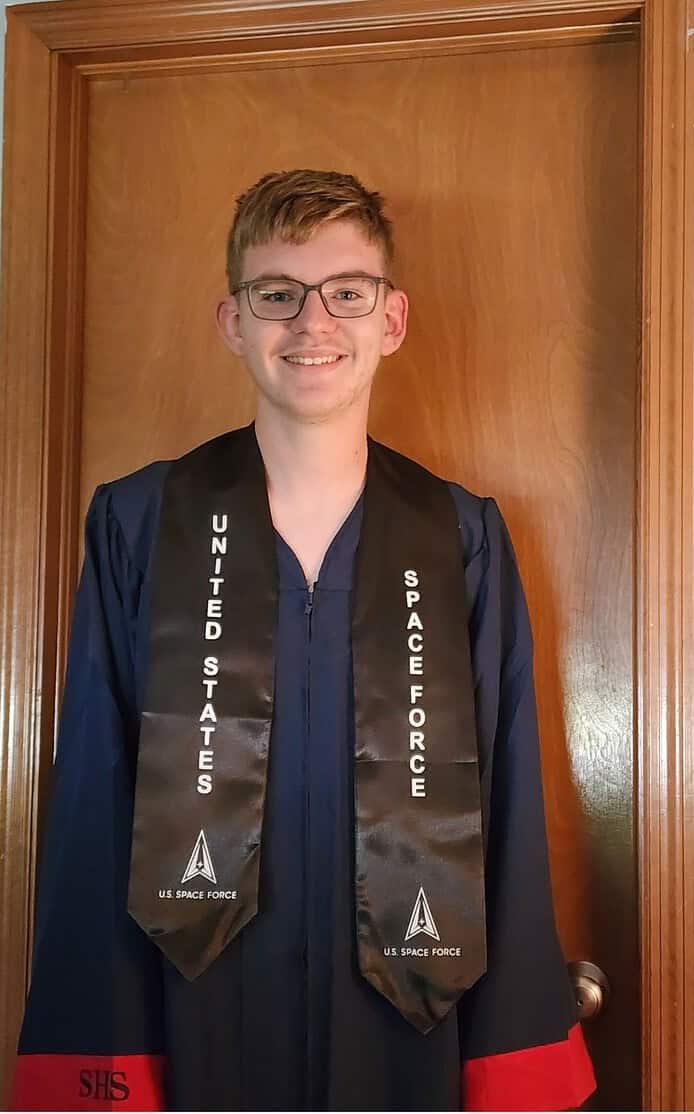 Hunter Gloetzner with his graduation gown and Space Force stole. [Photo credit: David Gloetzner]