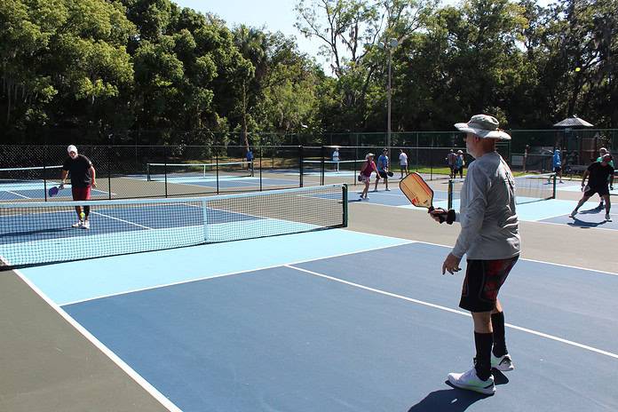 Nick Pingitore (left) and Martin Ratcliffe (right) demonstrate pickleball techniques on Wednesday. [Photo by Austyn Szempruch]