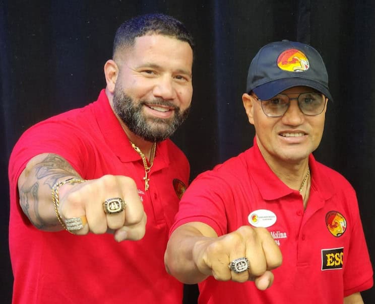 Chelo Jose Alonzo (left) and John Molina (right) show off their new FBOH rings on Sunday. [Photo by Austyn Szempruch]