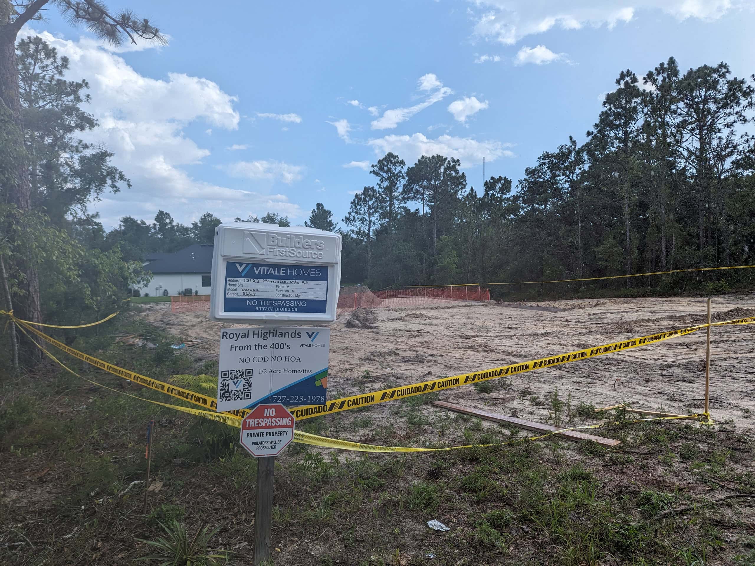 Vitale Homes permit box where they were building the Verona model home until a sinkhole formed last week. [Photo by Julie Maglio]