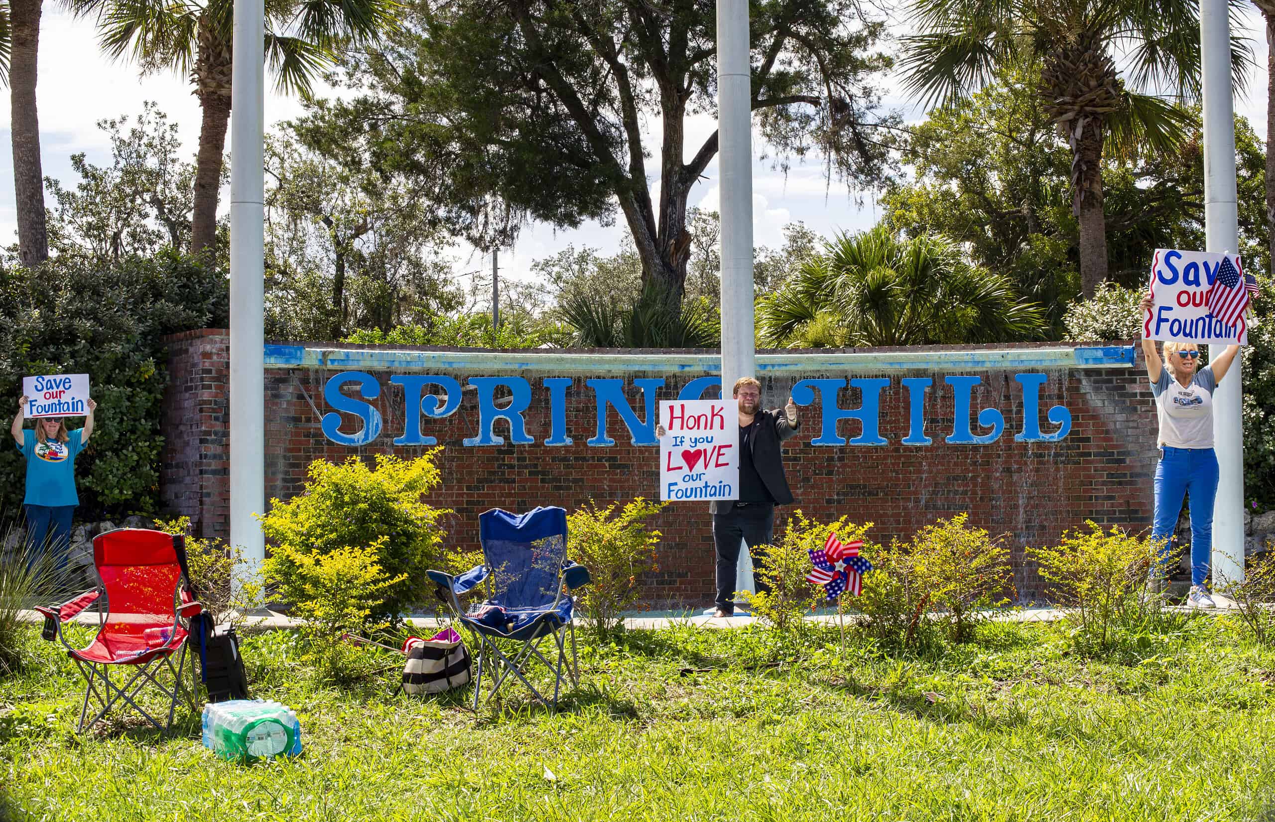 Residents show their support for preserving the Spring Hill Waterfall on Saturday, June 22. [Photo by Julie Maglio]
