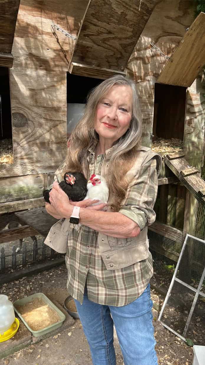 Linda White-Francis with her chickens Jetta and Harper [Courtesy photo]