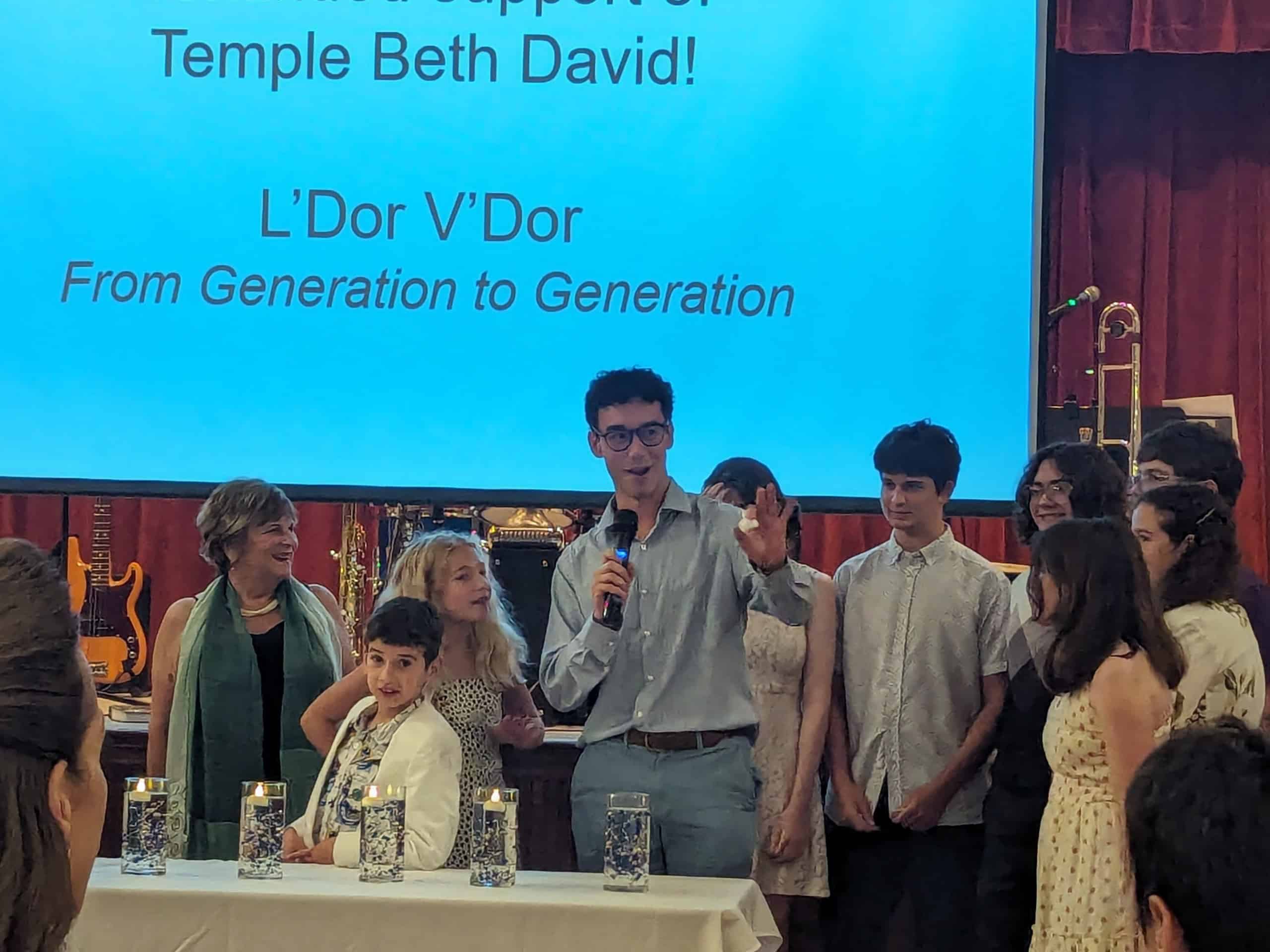 Temple Beth David's L'Dor V'Dor ceremony, celebrating the passage of Jewish tradition and faith from generation to generation. Marlene Shaw, far left, with the next generation [Photo by Julie Maglio]