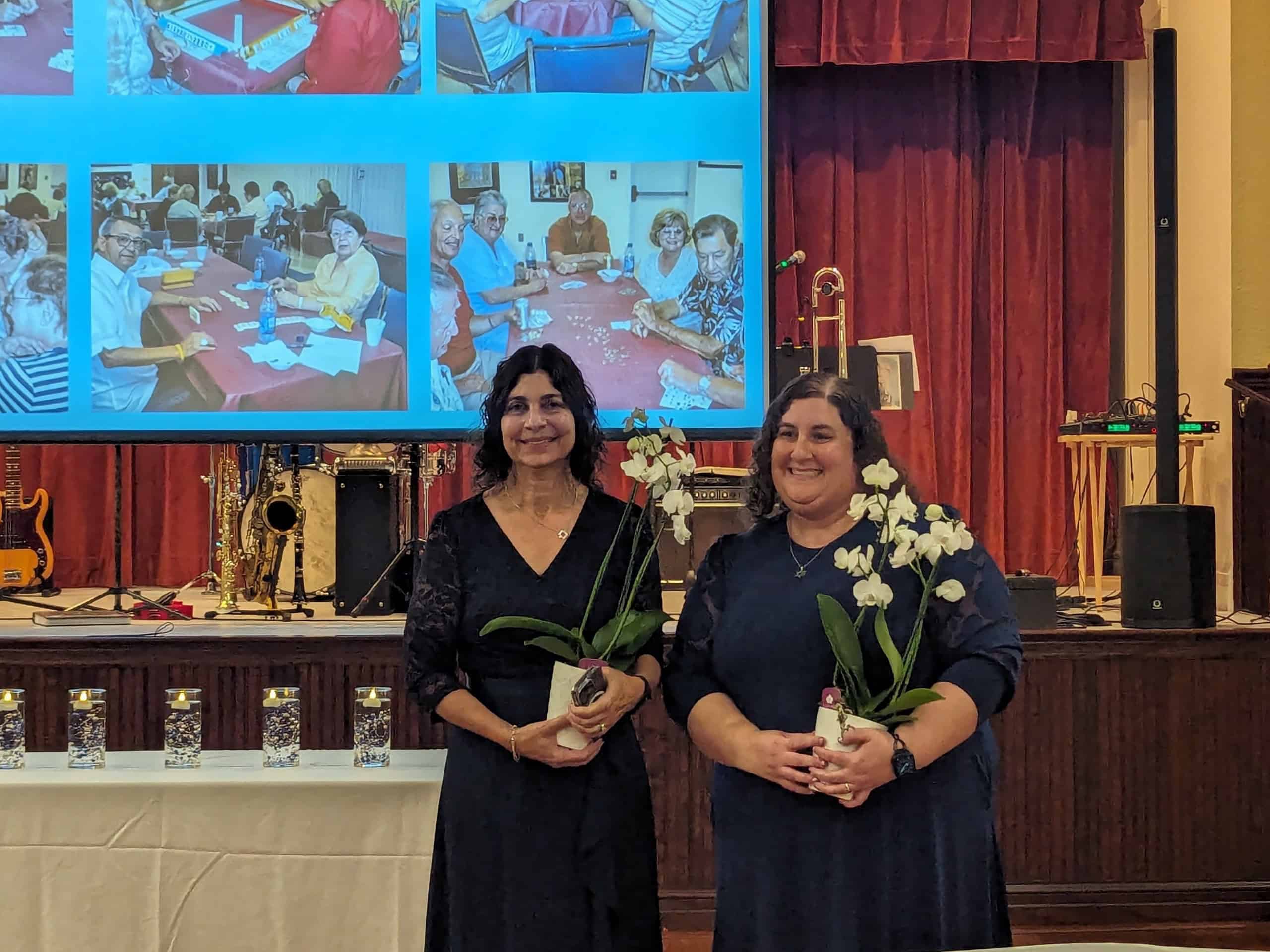 Heidi Shilensky, left and Nava Cohen are honored for their efforts to organize Temple Beth David's 50th Anniversary Gala. [Photo by Julie Maglio]