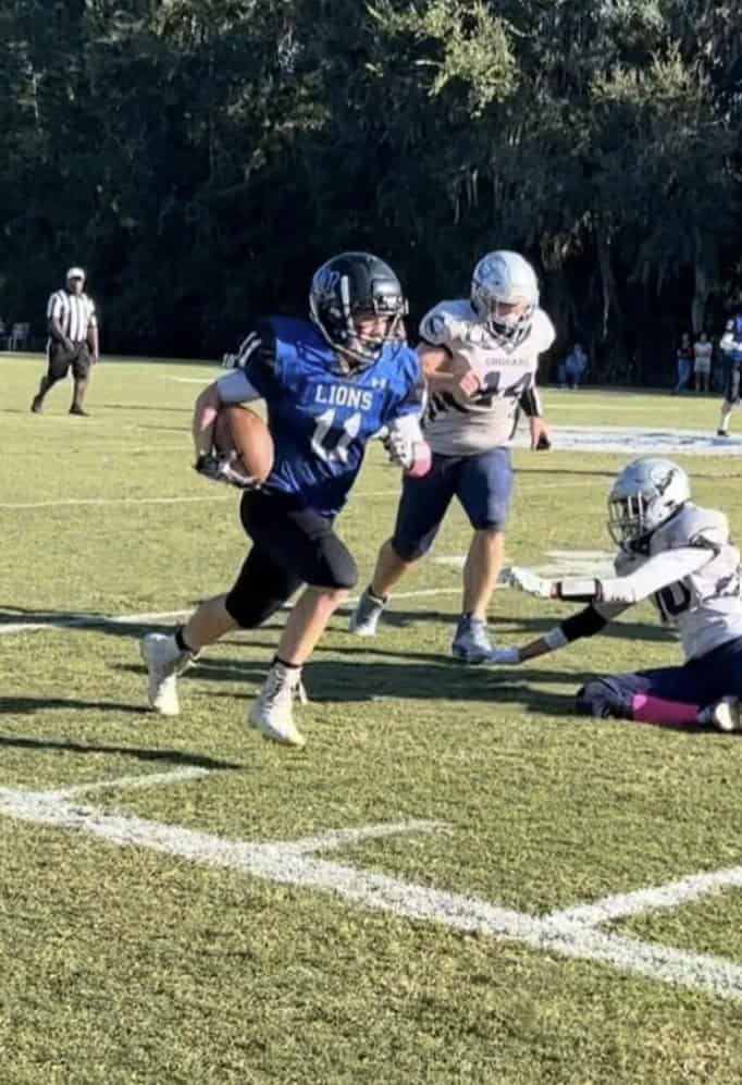 Trenton Sellers, 11, carries the ball against the Cornerstone Academy Cougars. [Photo provided by Mike Sellers]