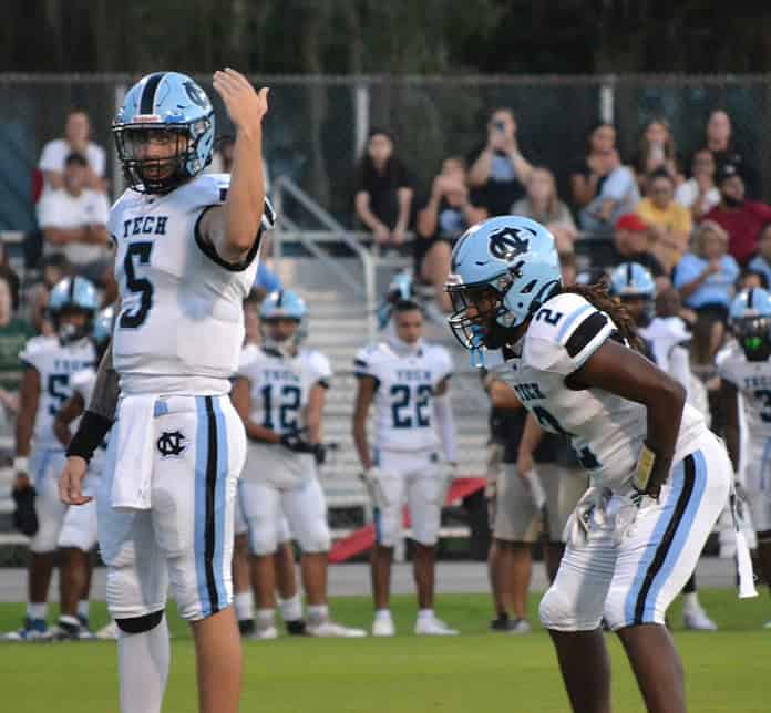 Nature Coast quarterback Jackson Hoyt motions to a receiver prior to a play against Citrus in a preseason game on Aug. 16 in Inverness. [Chris Bernhardt Jr.]