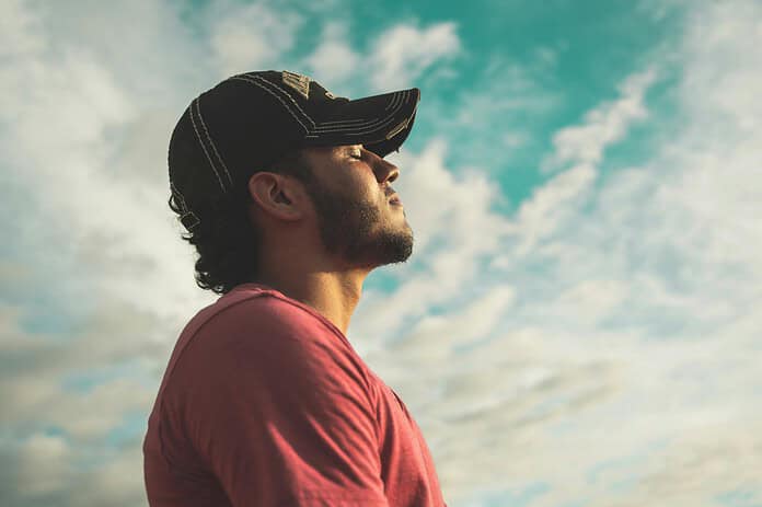 Man looking up to the sky