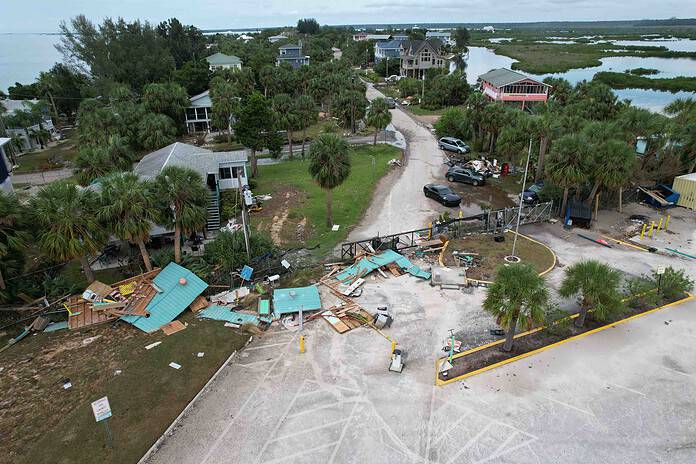 Storm Surge devasted the entry building and a concession stand at Pine Island. The wooden retaining wall built along the beach was also heavily damaged. [Credit: Mark Stone]