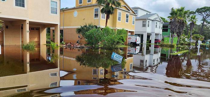 A home in Hudson sits in floodwaters two days after Helene passed. [Credit: Mark Stone]