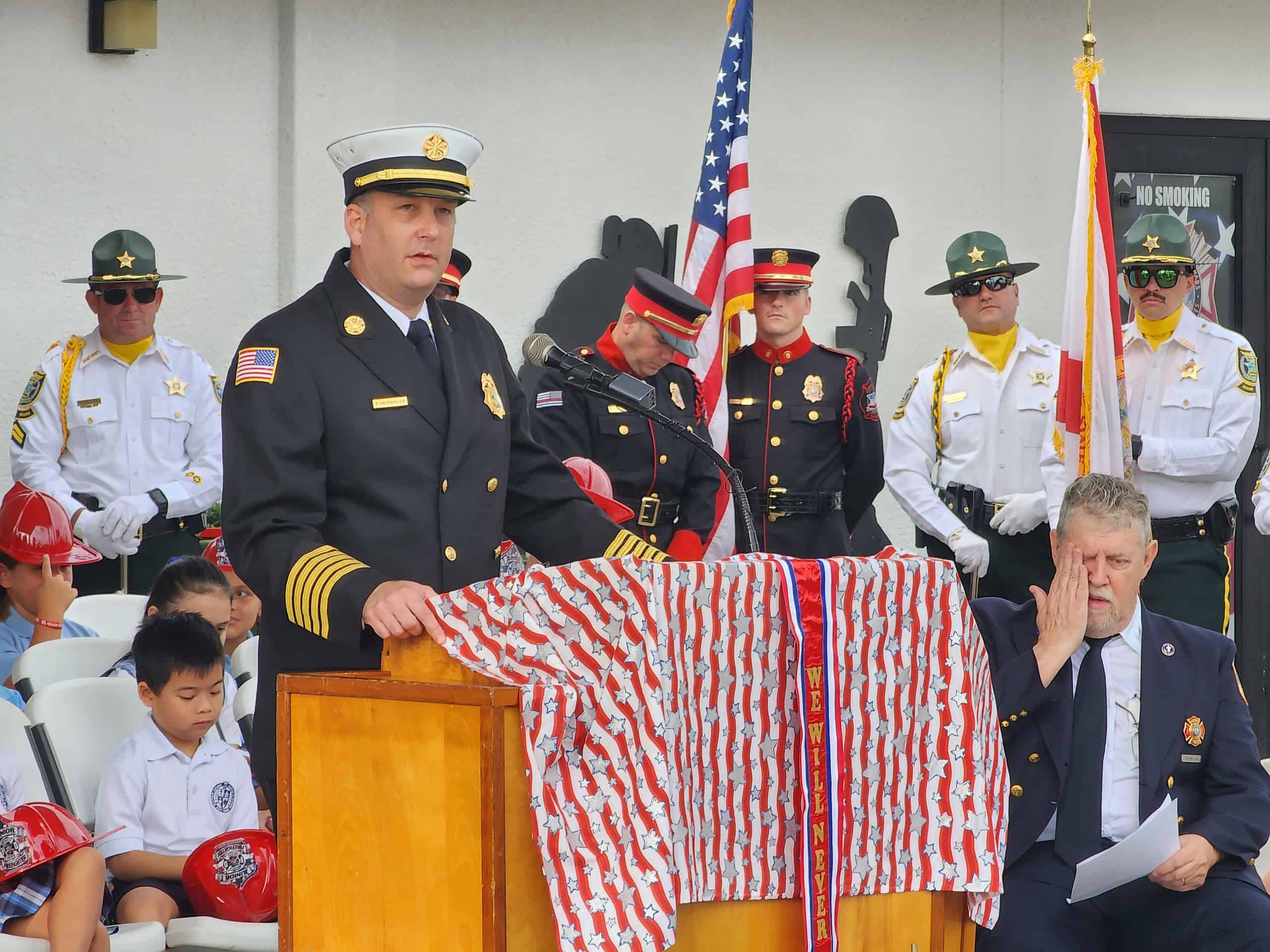 Fire Chief Paul Hasenmeier speaks at the VFW Post on Edward R. Knoll Drive at Wednesday's 9/11 remembrance. [Photo by Austyn Szempruch]