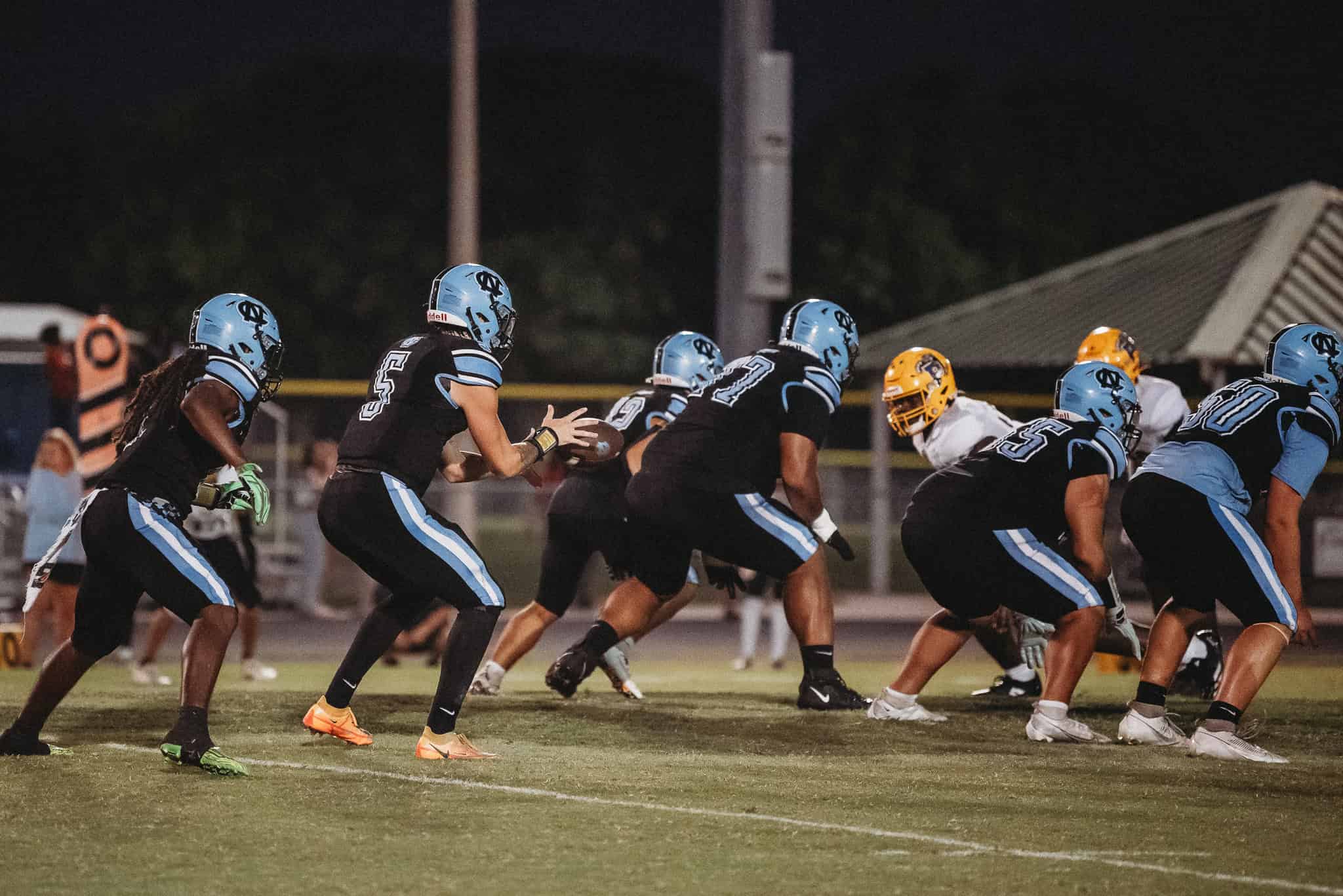 Shark's QB, Jackson Hoyt (#5) takes a snap at Nature Coast vs Palatka game. [Photo by Cynthia Leota]