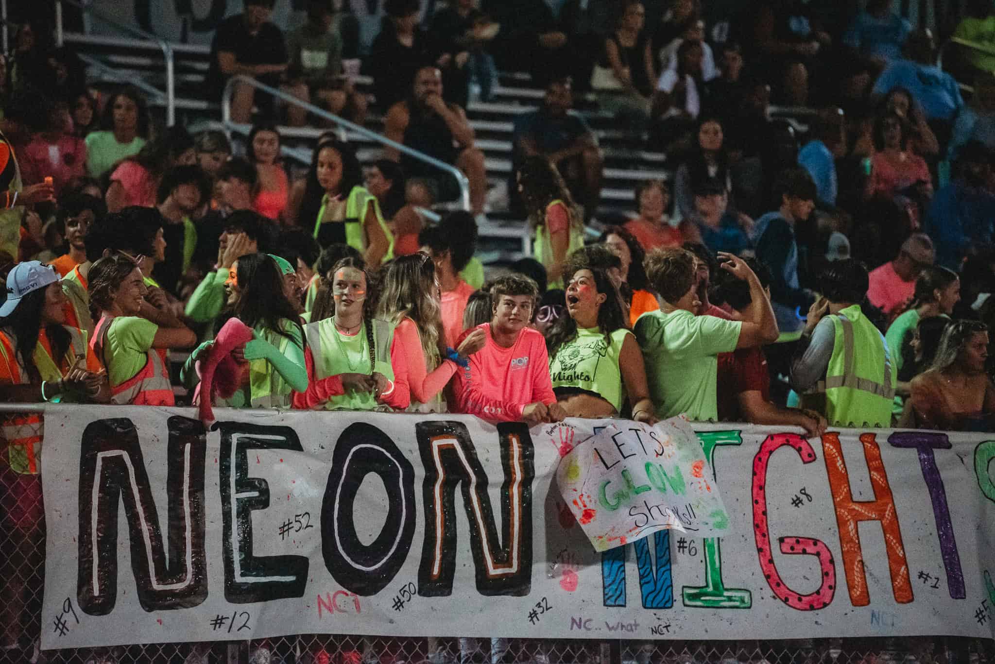 Nature Coast's student section showing spirit at Neon Nights. [Photo by Cynthia Leota]