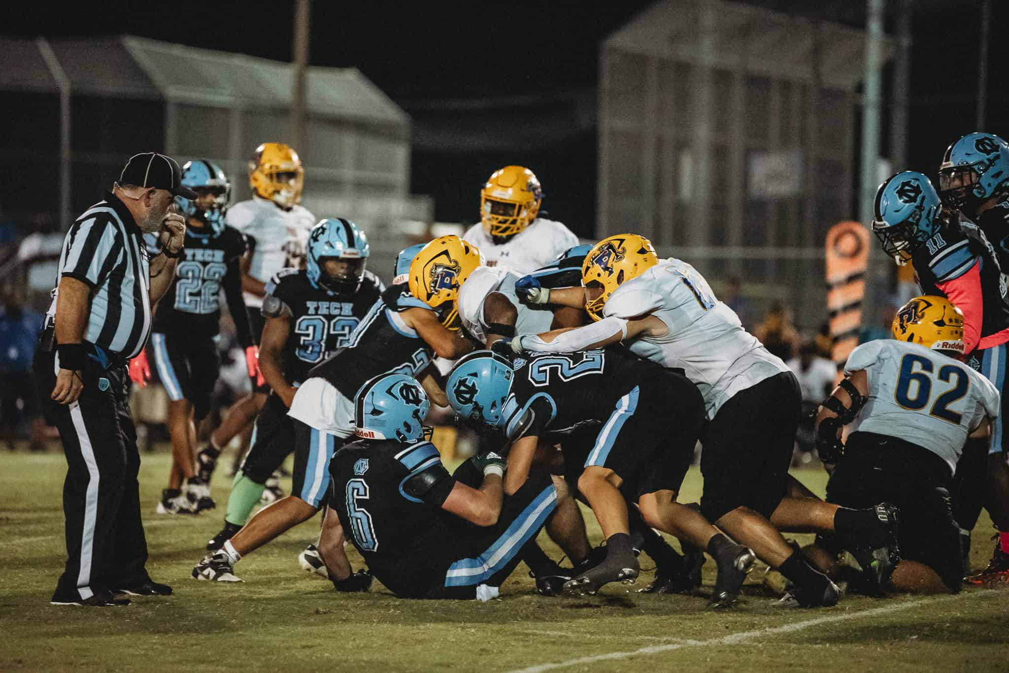 Palatka player taken down by school of Sharks. [Photo by Cynthia Leota]