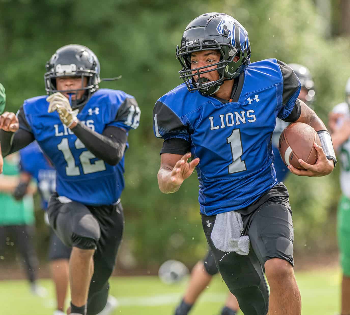 Hernando Christian Academy QB, 1,  Jaden Montzka gets around the end for a long gain versus visiting Ocala Christian Friday afternoon in Brooksville. [Photo by Joe DiCristofalo]