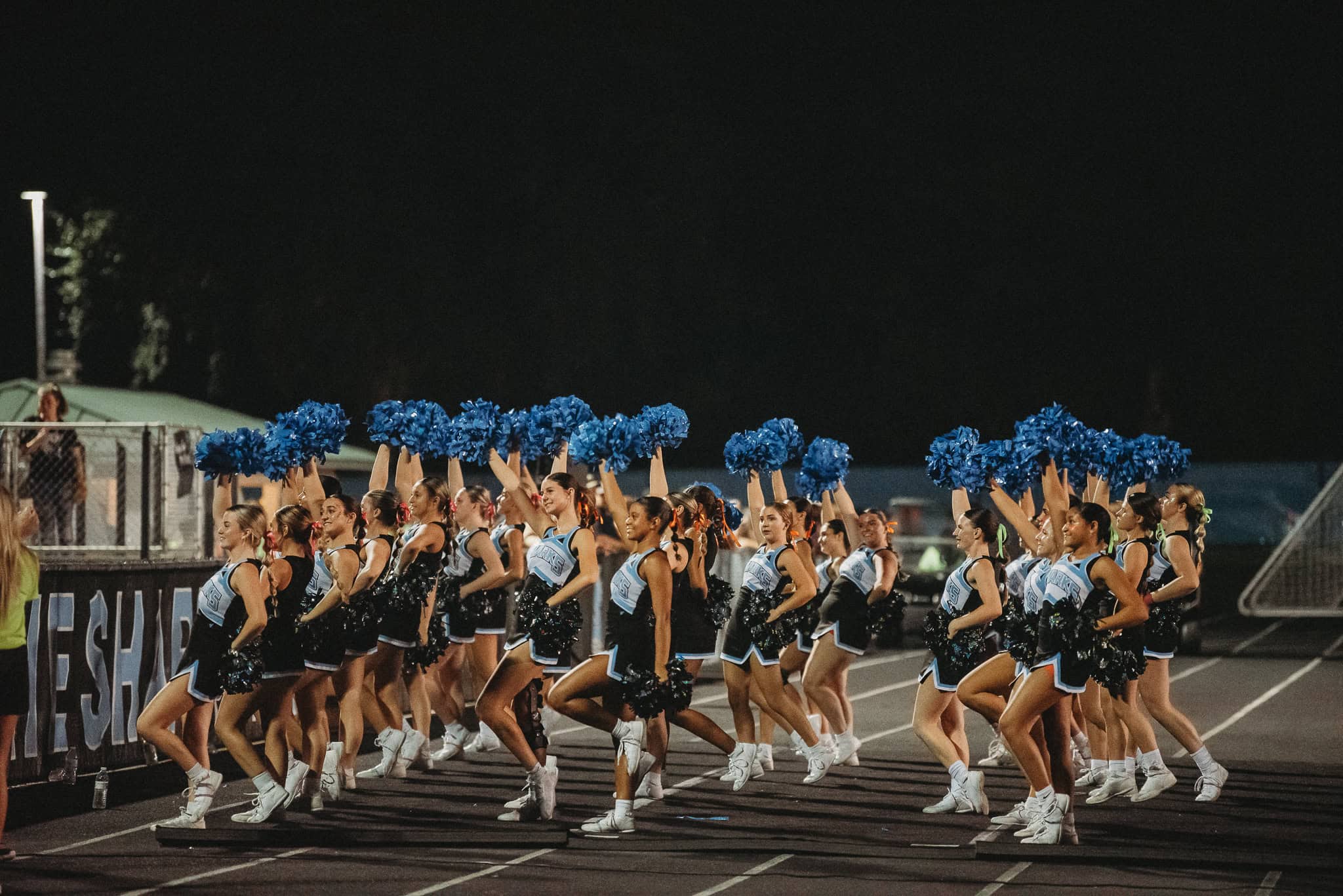 Nature Coast Cheerleaders cheering on Sharks Football. [Photo by Cynthia Leota]