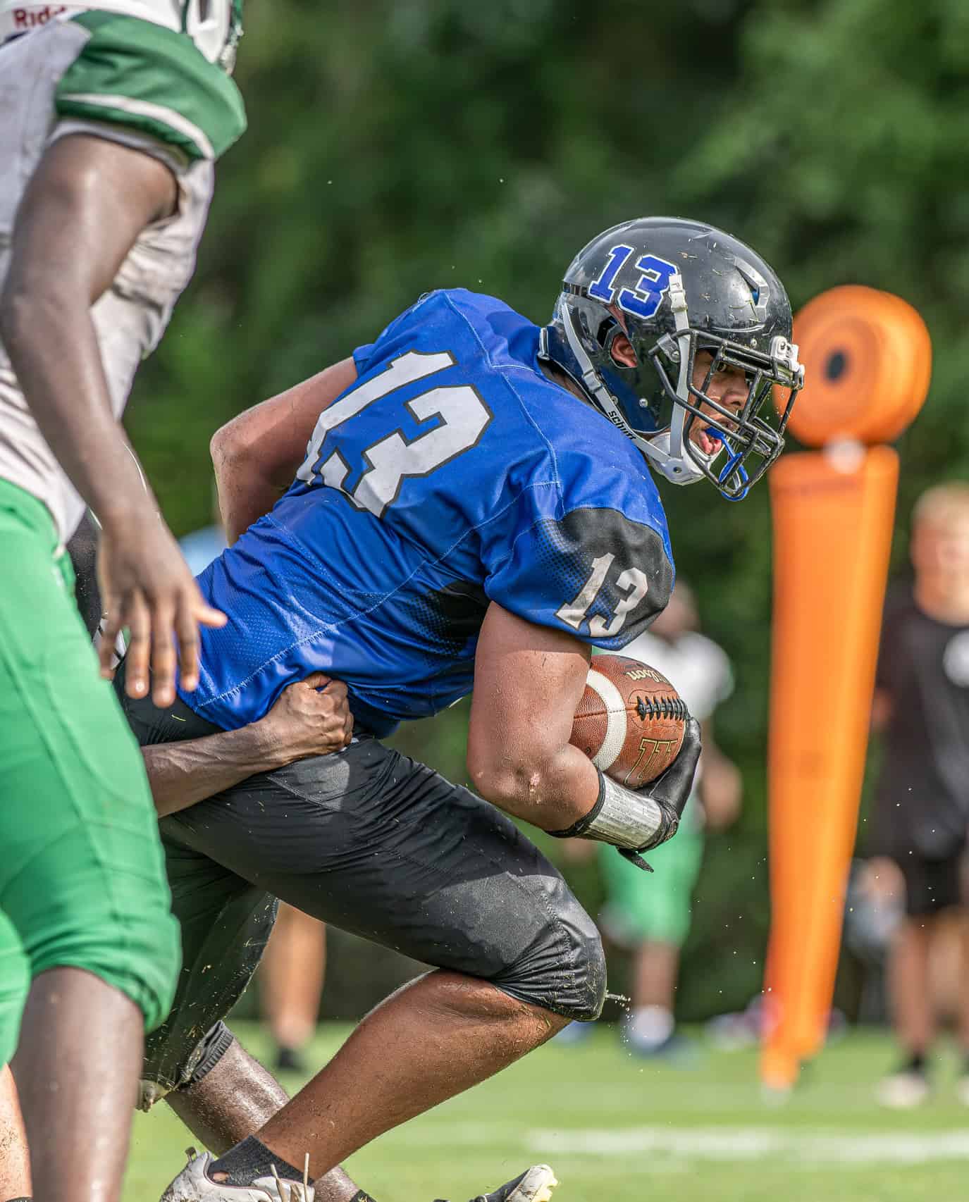 Hernando Christian Academy , 13, Tayvion Howard bursts through the  Ocala Christian defense Friday afternoon in Brooksville. [Photo by Joe DiCristofalo]