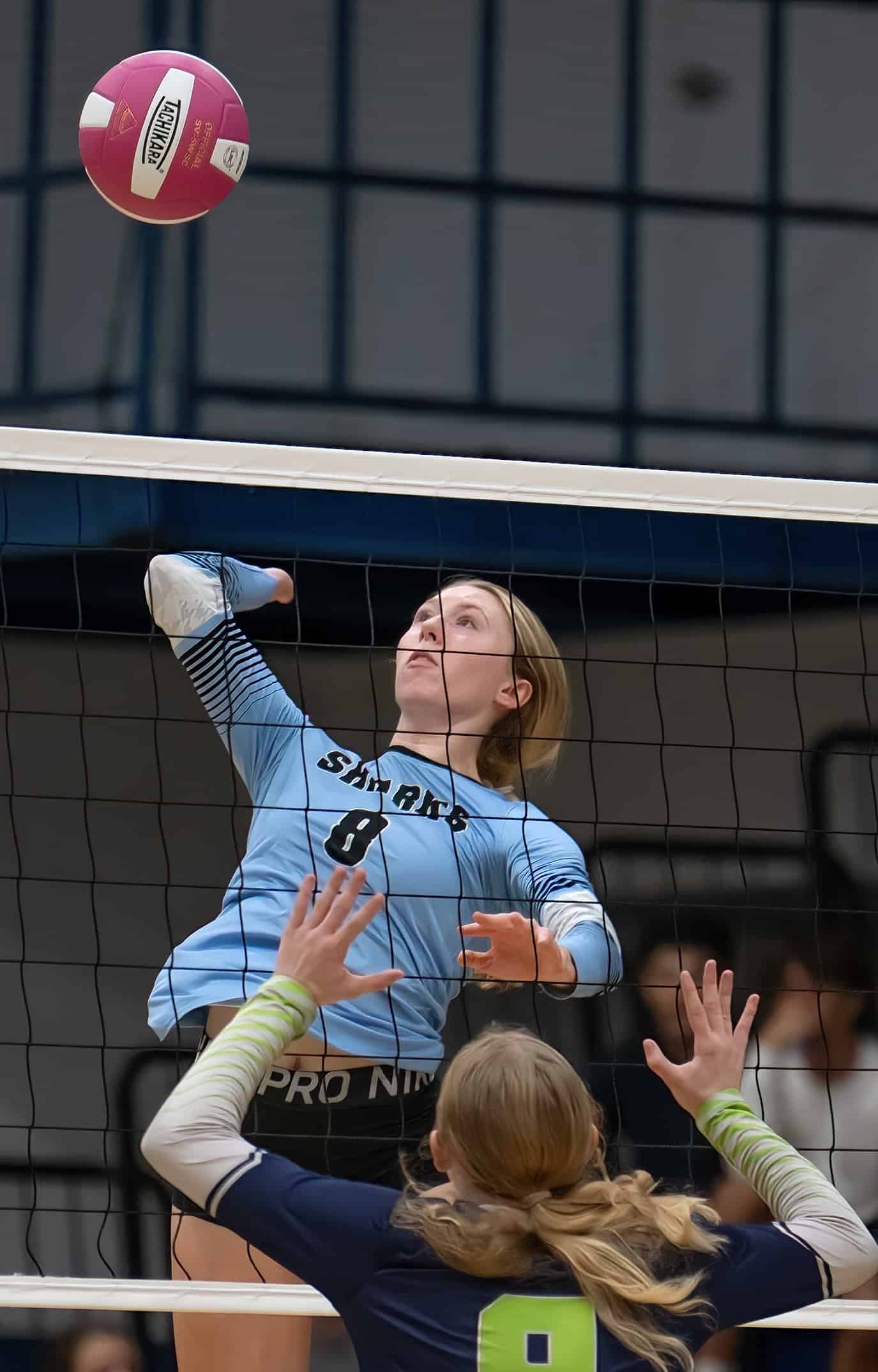 Nature Coast Tech, 8, Addy Carpenter goes high for a kill shot in the match at Central High. [Photo by Joe DiCristofalo]