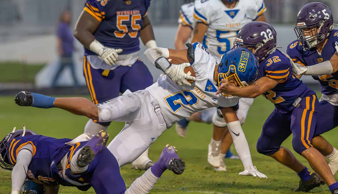 Hernando High,2,  Gabriel Sansone helps to put a stop to the progress of Crystal River High School, 2 Eric Jenkins. [Photo by Joe DiCristofalo]