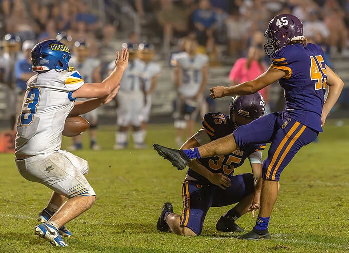 Hernando High , 45, Ernest Gay's attempt to tie the game with a field goal was blocked by Crystal River High 3, Cade Wentworth Friday night in Brooksville. [Photo by Joe DiCristofalo]