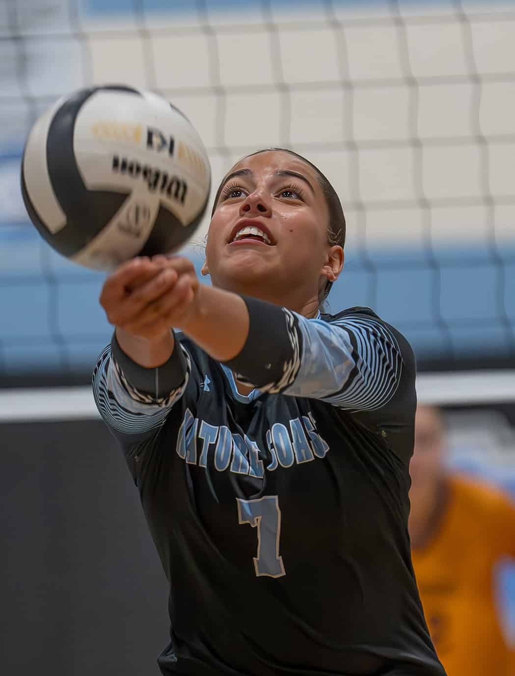 Nature Coast Tech, 7, Amanda Tirado extends to keep a volley alive in the match versus visiting Hernando High. [Photo by Joe DiCristofalo]