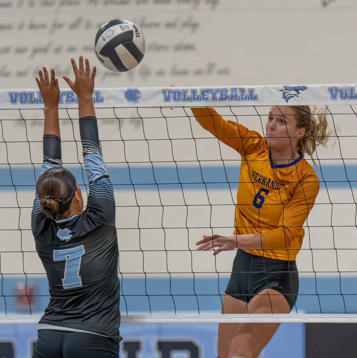 Hernando High, 6, Kaiya Ward hits over the defense by Nature Coast Tech ,7, Amanda Tirado Wednesday at NCT.  [Photo by Joe DiCristofalo]