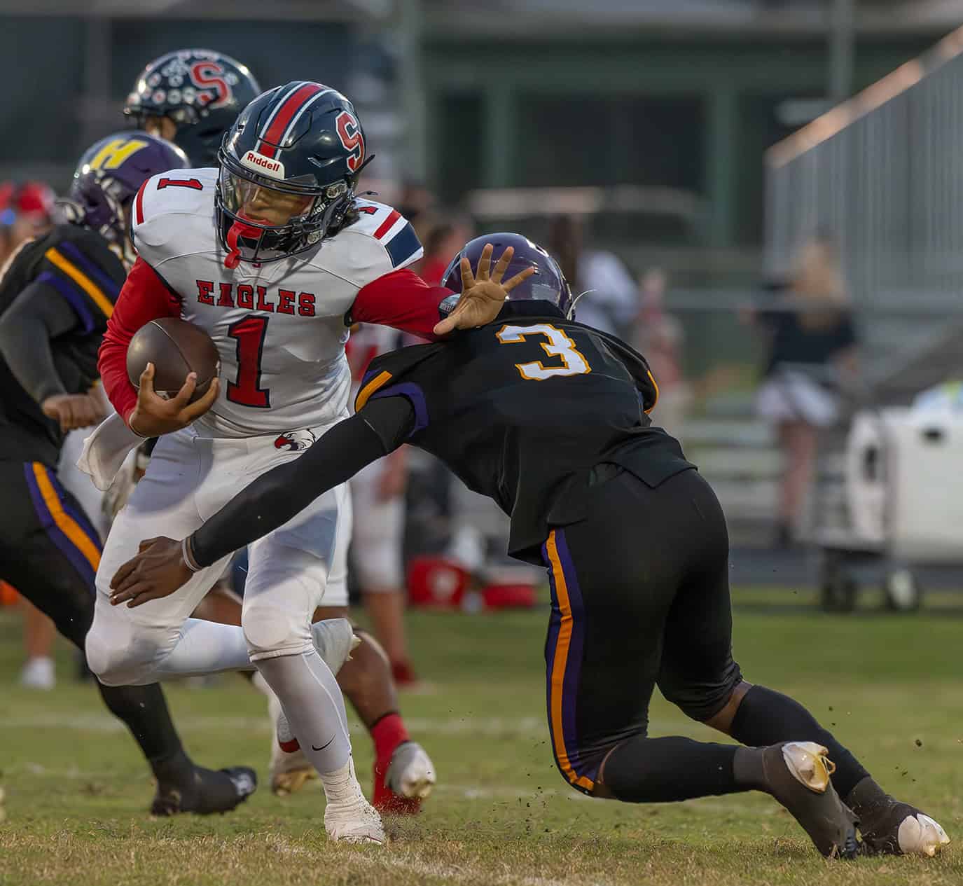 Hernando High , 3, Jerry Brown puts pressure on Springstead QB, 1, Gio Martinez Friday at Tom Fisher stadium. [Photo by Joe DiCristofalo]