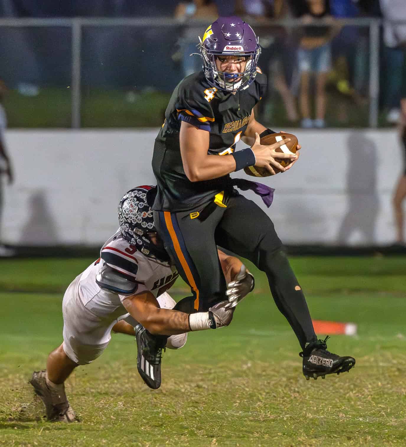 Springstead High, 5, Jadon Jaimes takes down Hernando QB Michael Saltsman during the "Glory Days Burger Bowl Game" Friday at Hernando High. [Photo by Joseph DiCristofalo]