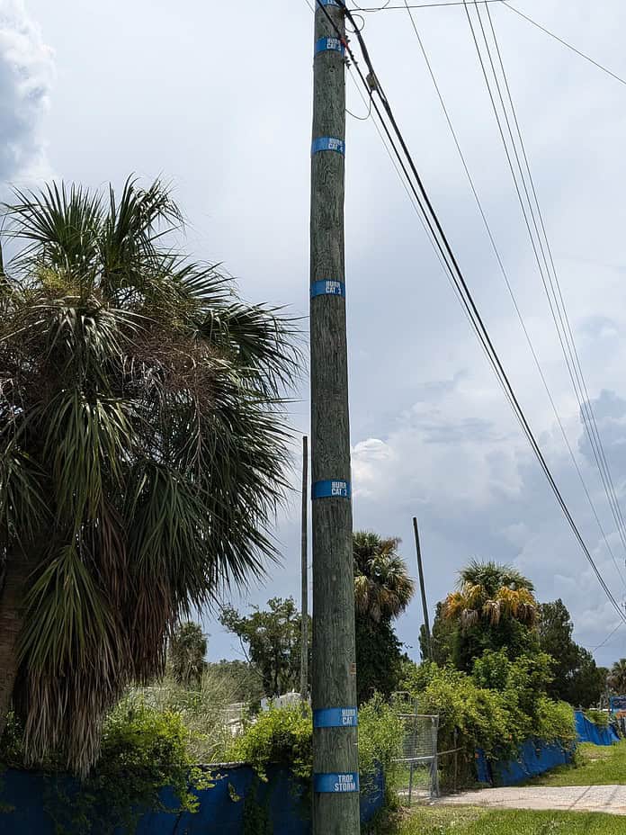 Hernando Beach powerline pole marking storm surge levels.