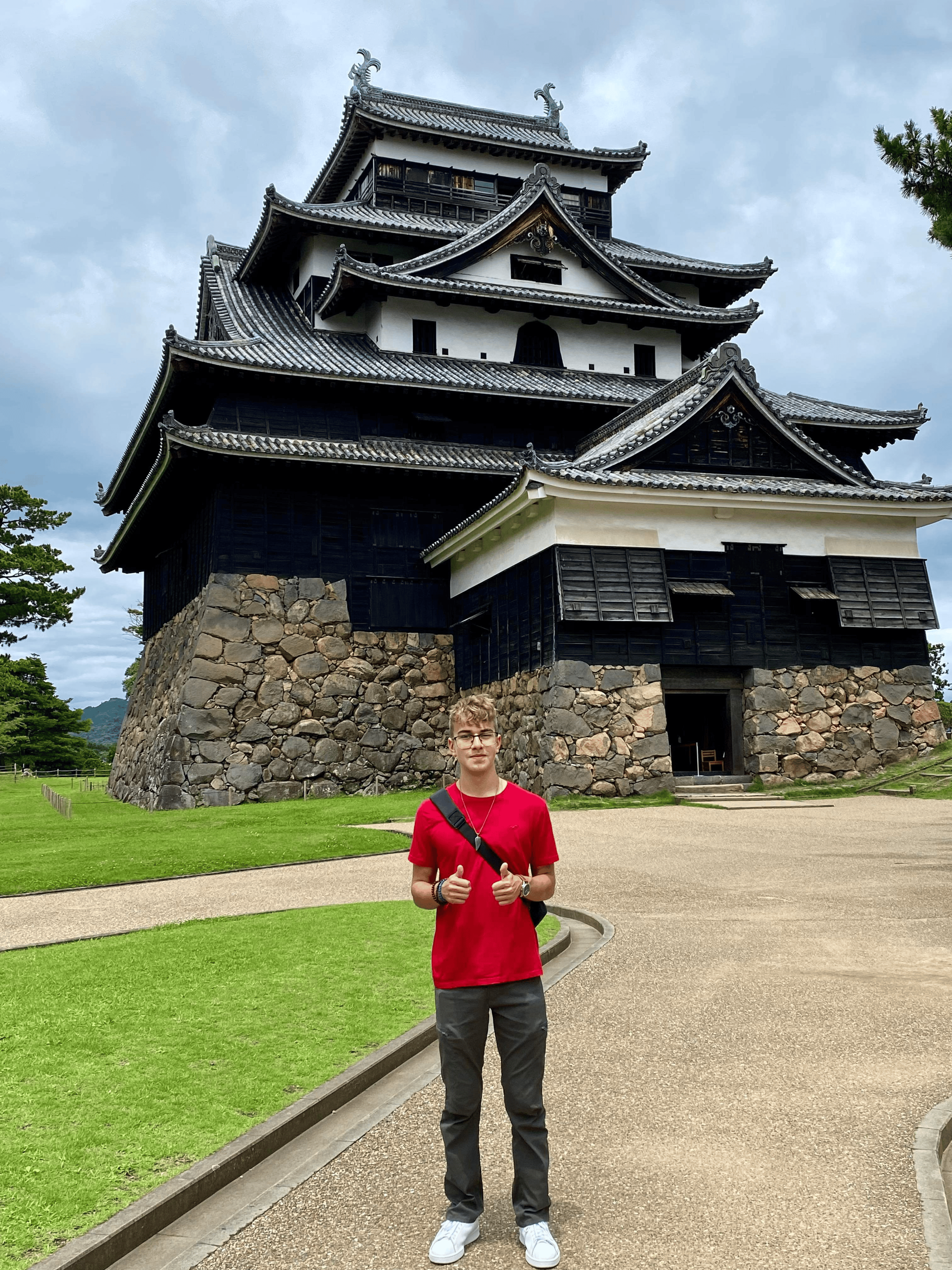 Braden Ottersbach in front of a Japanese temple
[Courtesy photo]