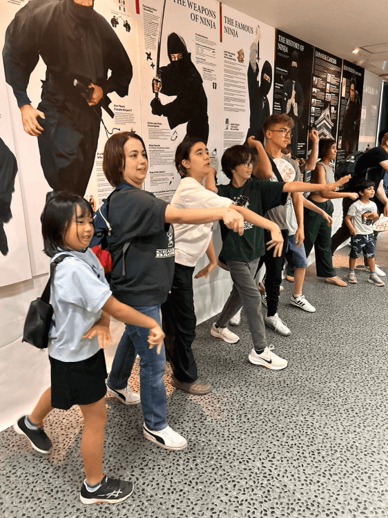 Ms. Takahashi teaching her students language through movement 
 [Courtesy photo]