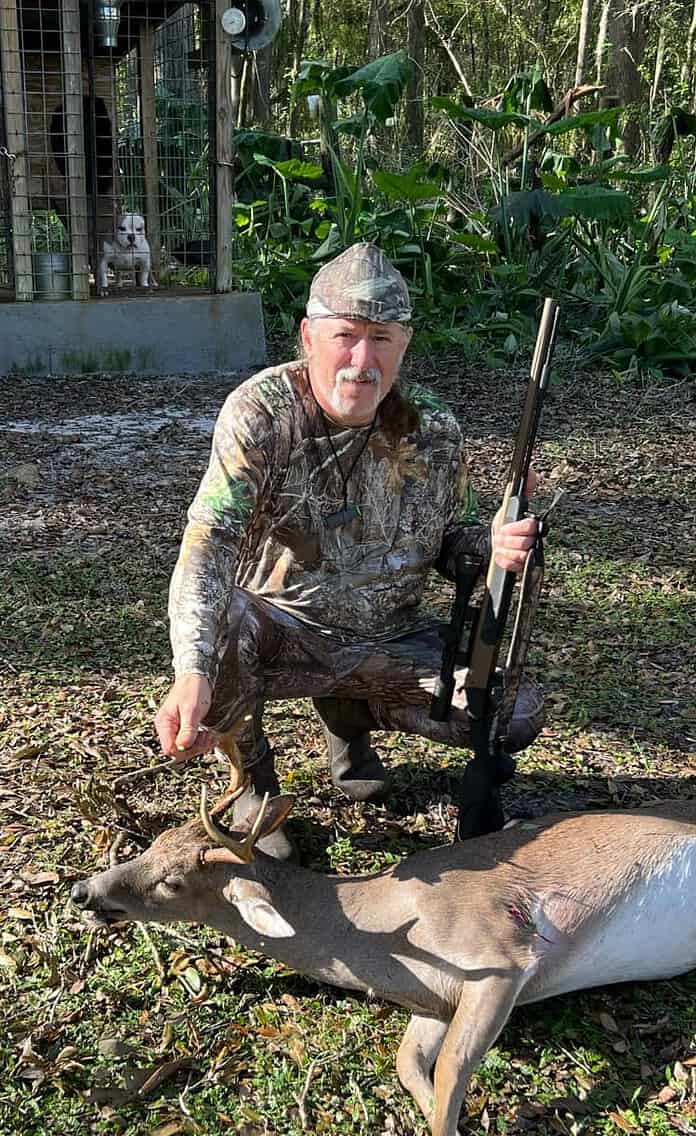 David Criswell and a mature eight point buck taken with his muzzleloader. [Photo by Toby Benoit]