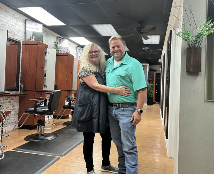 Owners Bobbi and Kyle Barnes in their salon. [Photo credit: Sue Quigley]