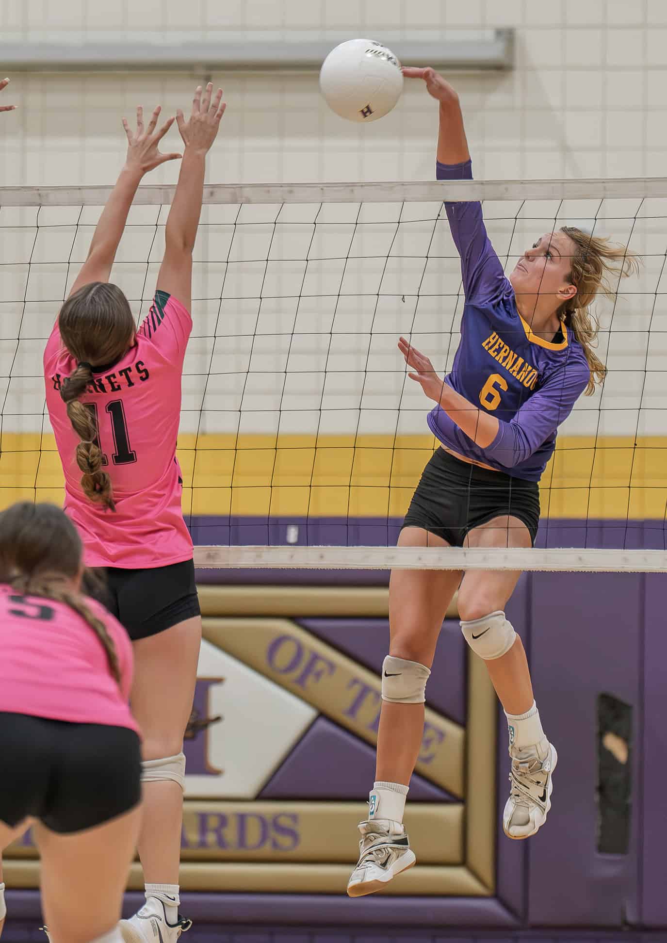 Hernando High, 6, Kaiya Ward elevates for a kill shot in the 4A District 8 playoff match against Weeki Wachee High. [Photo by Joe DiCristofalo]