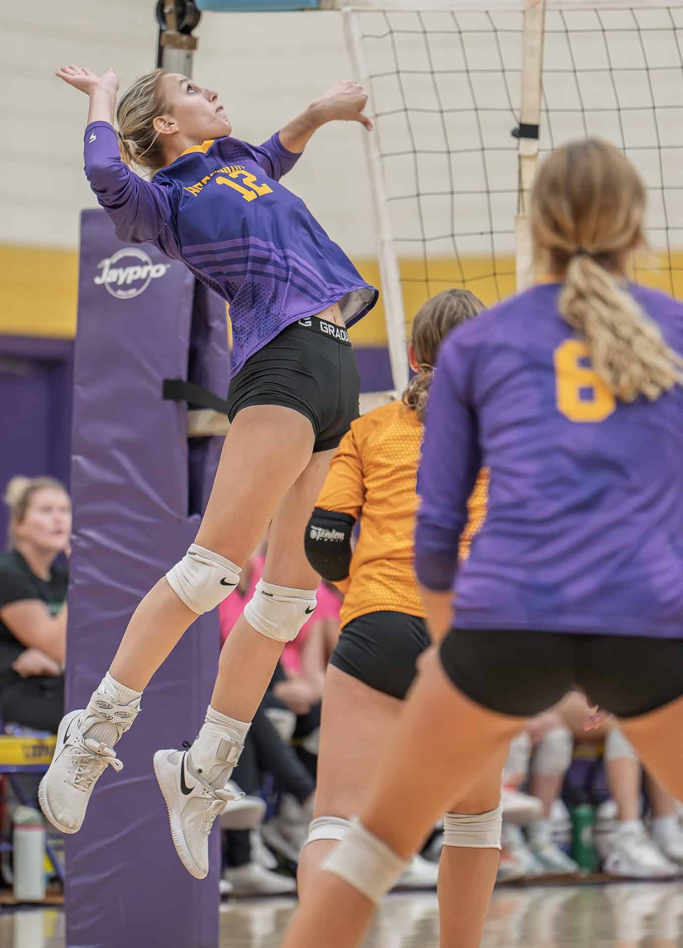 Hernando High, 12, Bailey Poe elevates for a kill shot in the 4A District 8 playoff match against Weeki Wachee High. [Photo by Joe DiCristofalo]