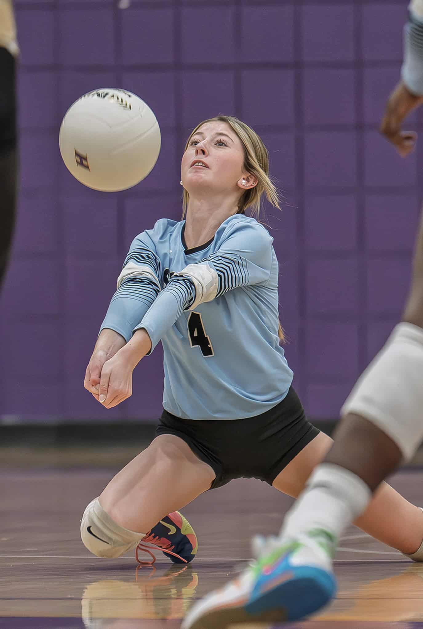 Nature Coast Tech, 4, Adalei Harmon digs a volley in the 4A District 8 playoff match with Citrus High. [Photo by Joe DiCristofalo]