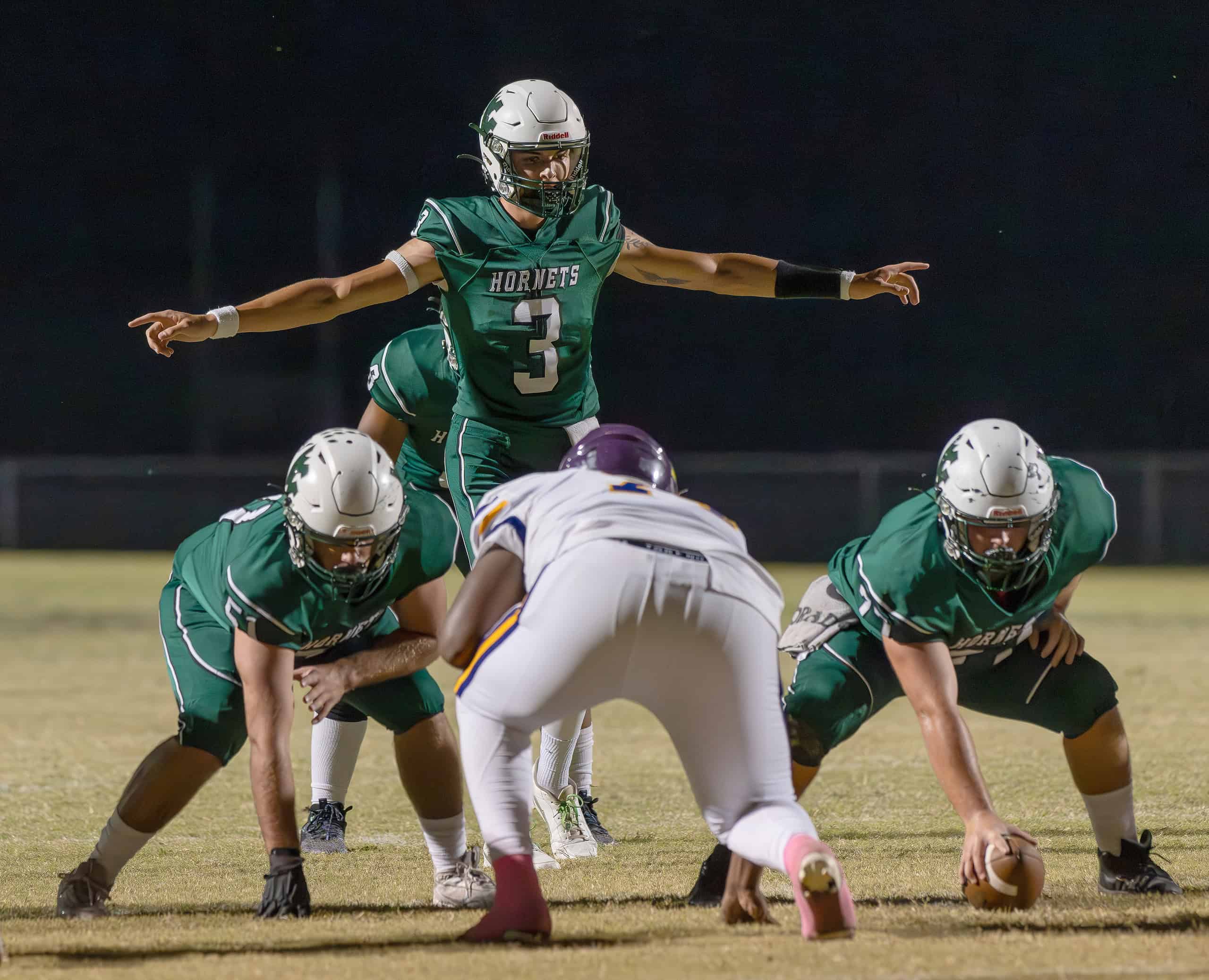 Weeki Wachee High QB, 3, Richard Hanshaw sizes up the defense before a play in the game with visiting Hernando High. [Photo by Joe DiCristofalo]