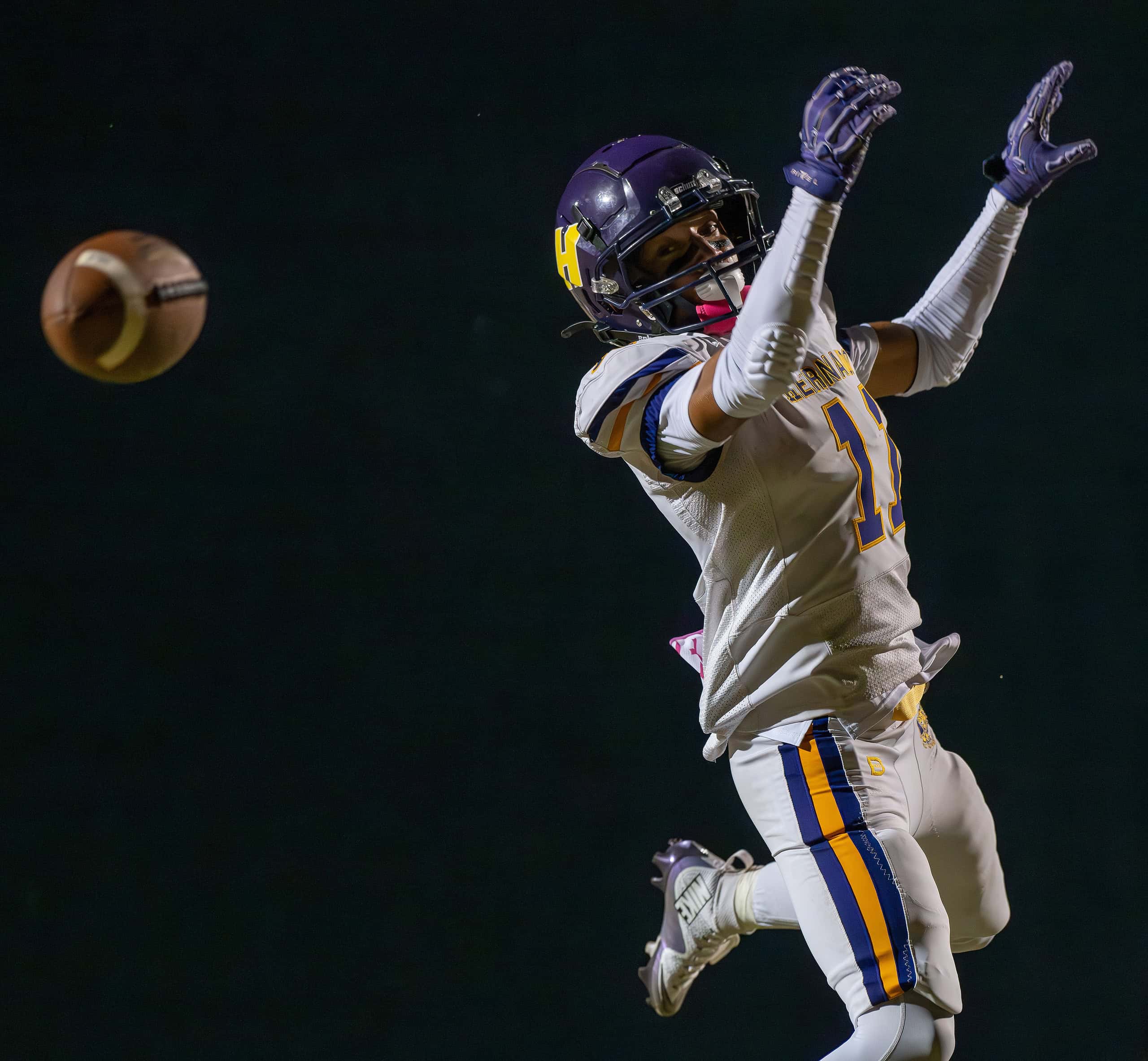 Hernando High ,11, Kamoni Dotson watches as a potential scoring pass sails over his reach Friday at Weeki Wachee High. [Photo by Joe DiCristofalo]