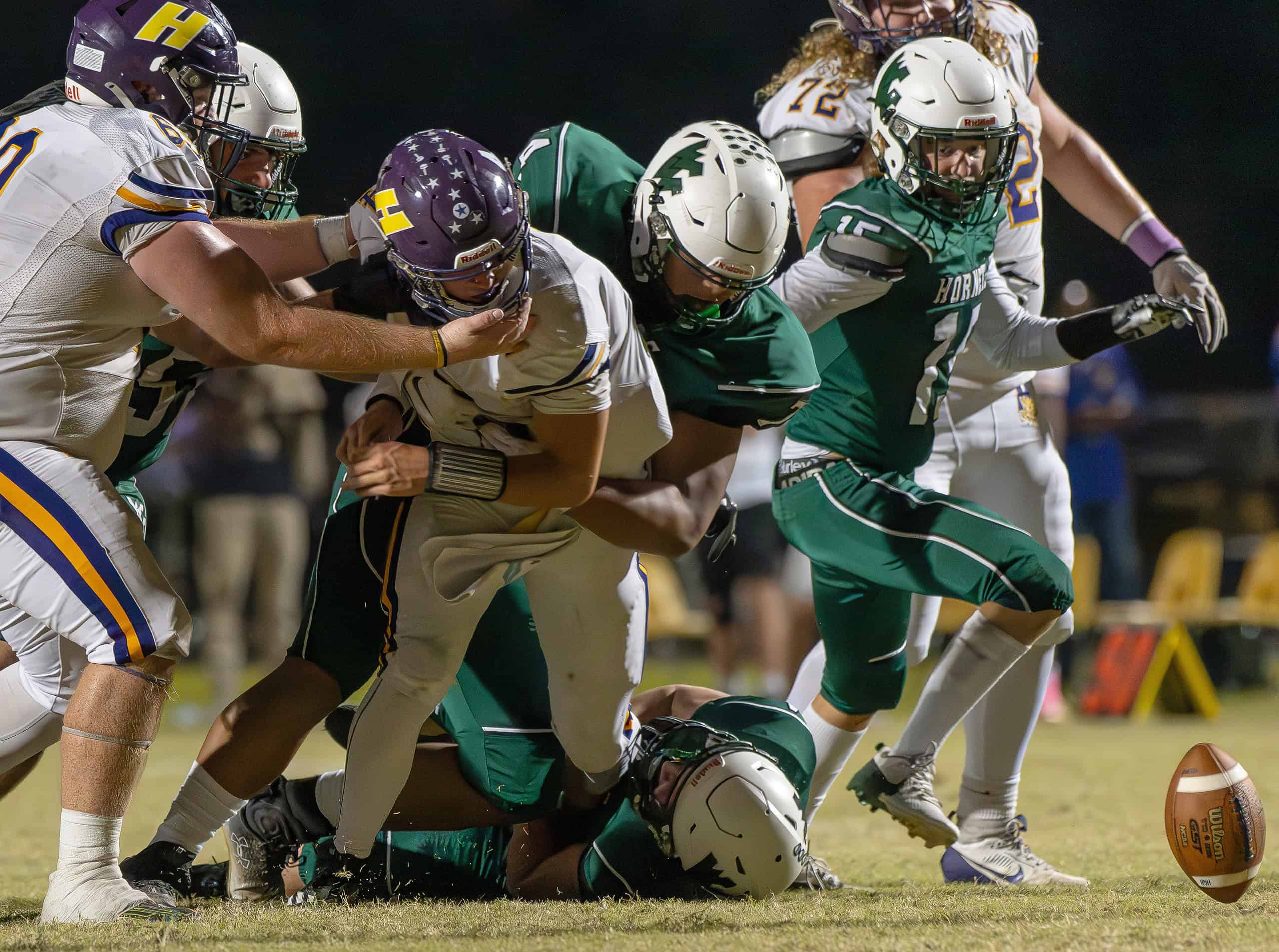 Weeki Wachee High, 7, Michael Schmidt separated the ball from Hernando High QB, Michael Saltsman. The play resulted in a turnover. [Photo by Joe DiCristofalo]