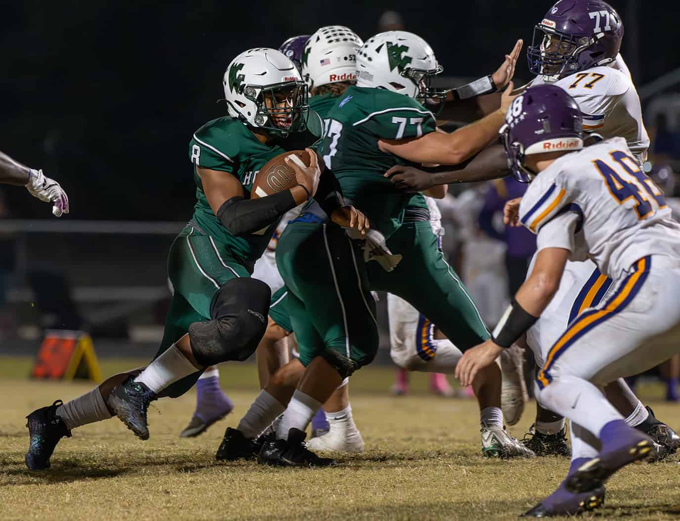 Weeki Wachee High ,8, Leelan Wright accelerates into the line in the game with visiting Hernando High. [Photo by Joe DiCristofalo]