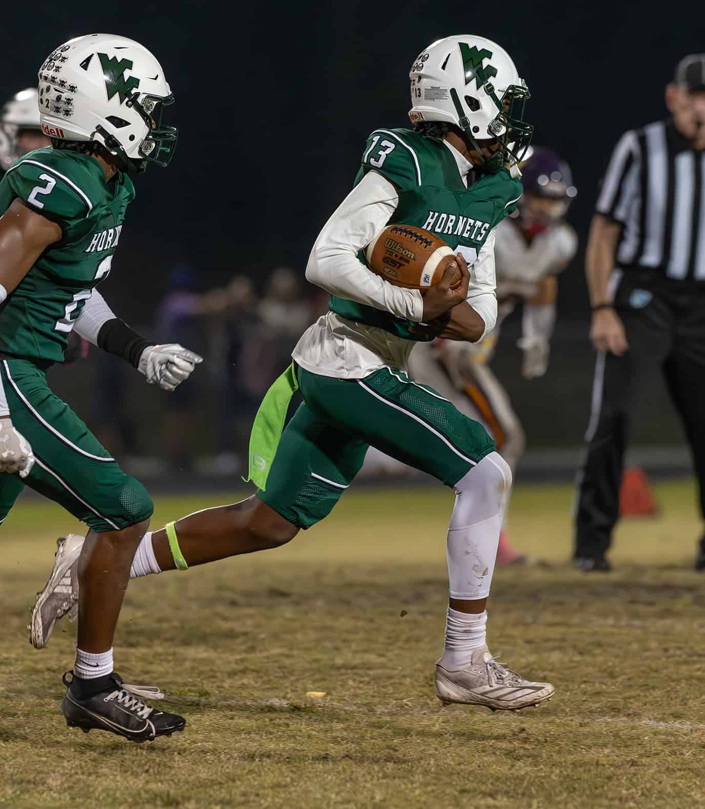 Weeki Wachee High ,13, Keavin Moss runs after an interception late in the game with visiting Hernando High. [Photo by Joe DiCristofalo]