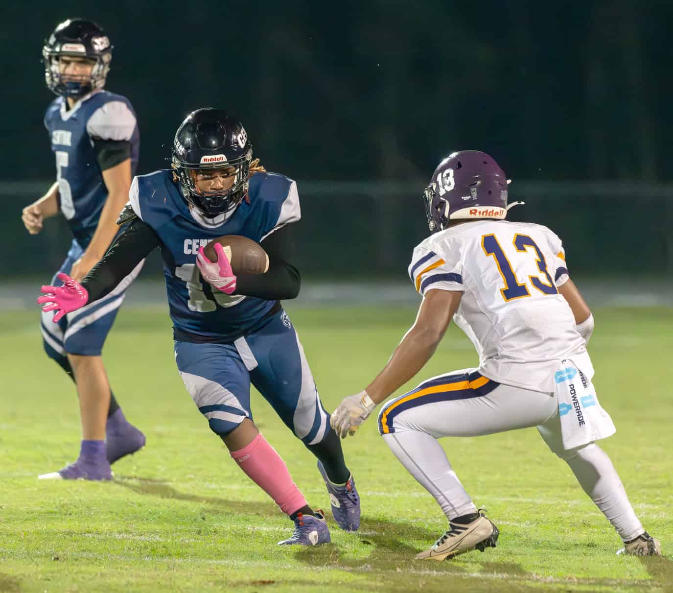 Central High's, 10, Jesiah Melvin looks to get by a tackle by Hernando High, 13, Jason Ingram. [Photo by Joe DiCristofalo]