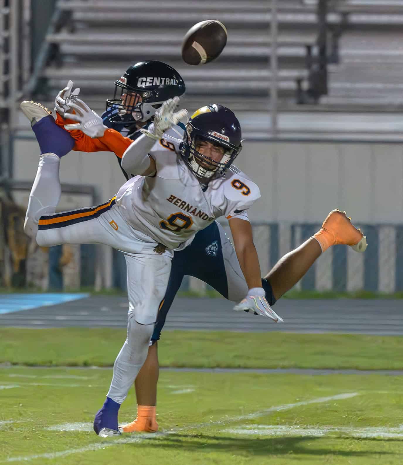 Central High's, 11, Alvin Cortes and Hernando High ,9,Isaiah Williams vie for the ball during a Central High pass attempt. [Photo by Joe DiCristofalo]