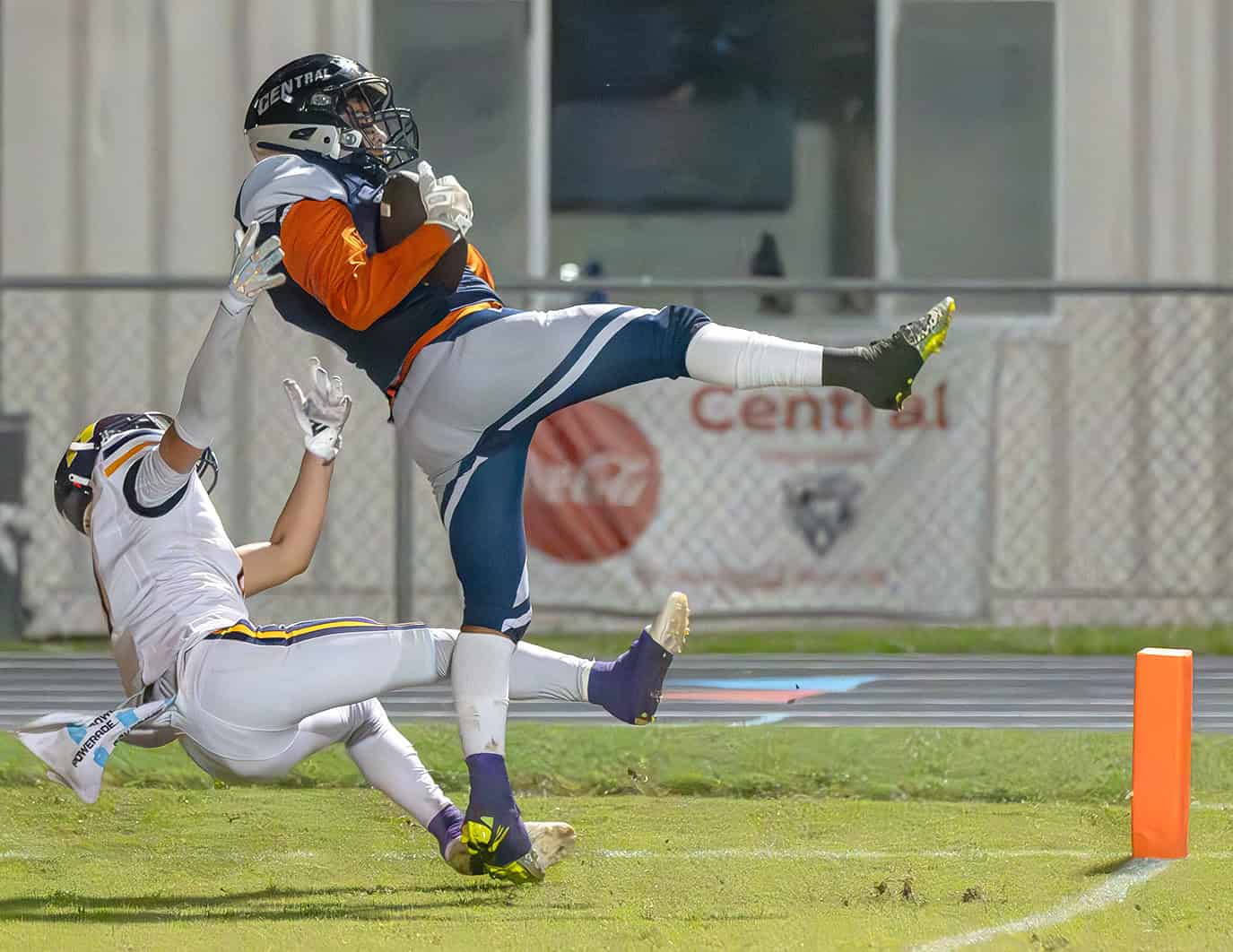 Central High's, 7, Josiah Ojeda snares a touchdown pass despite the coverage by Hernando High, 9, Isaiah Williams. [Photo by Joe DiCristofalo]